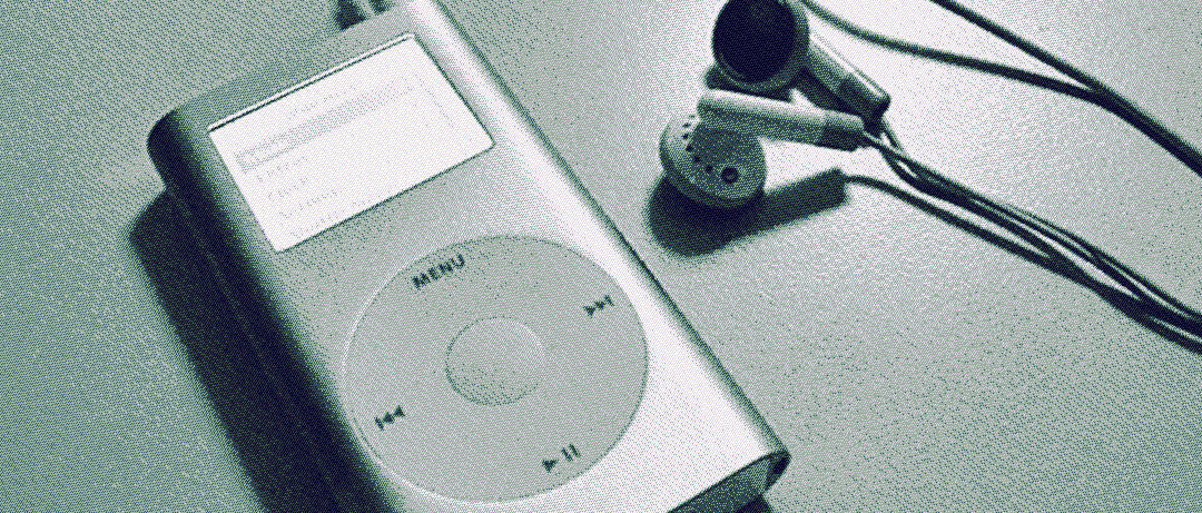 iPod Mini sitting with a pair of headphones