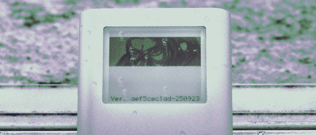 iPod Mini sitting with a pair of headphones